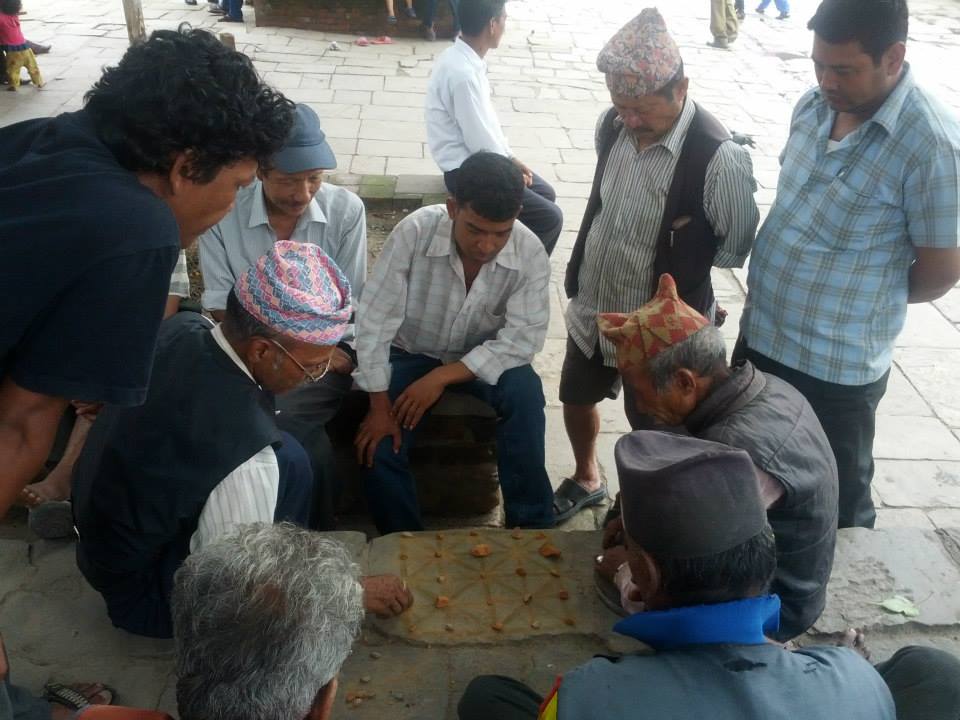 Elderly players enjoing Baghchal at Basantapur Durbar Square Elderly players enjoing Baghchal at Basantapur Durbar Square